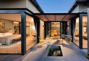 Where It All Began - Ethical Luxury Travel from Victoria Falls to Cape Town - Johannesburg - The Peech Hotel - Outside View Of Firepit and Bedrooms