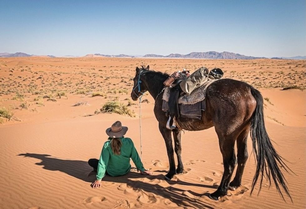 Where It All Began - Namibia & Okavango Overlanding 4x4 Adventure - Sossusvlei and Sesriem - Woman and Horse in the Desert