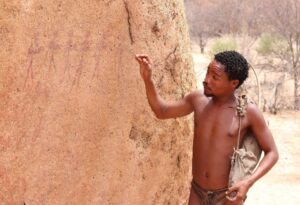 Where It All Began - Namibia & Okavango 4x4 Self Drive African Safari - Tsodilo Hills - Tsodilo Community Campsite - Tribal Man Looking at Rock Paintings
