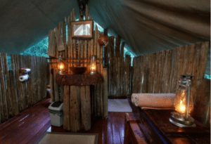 Where It All Began - African Glamping Safari - Eastern Cape - Quatermain's 1920s Safari Camp (DLB&B) - Lanterns Lighting Log Cabin