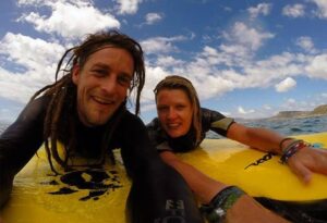 Where It All Began - Soulful Waves Spiritual Retreat - Muizenberg - African Soul Surfer - Smiling Couple on Surf Boards