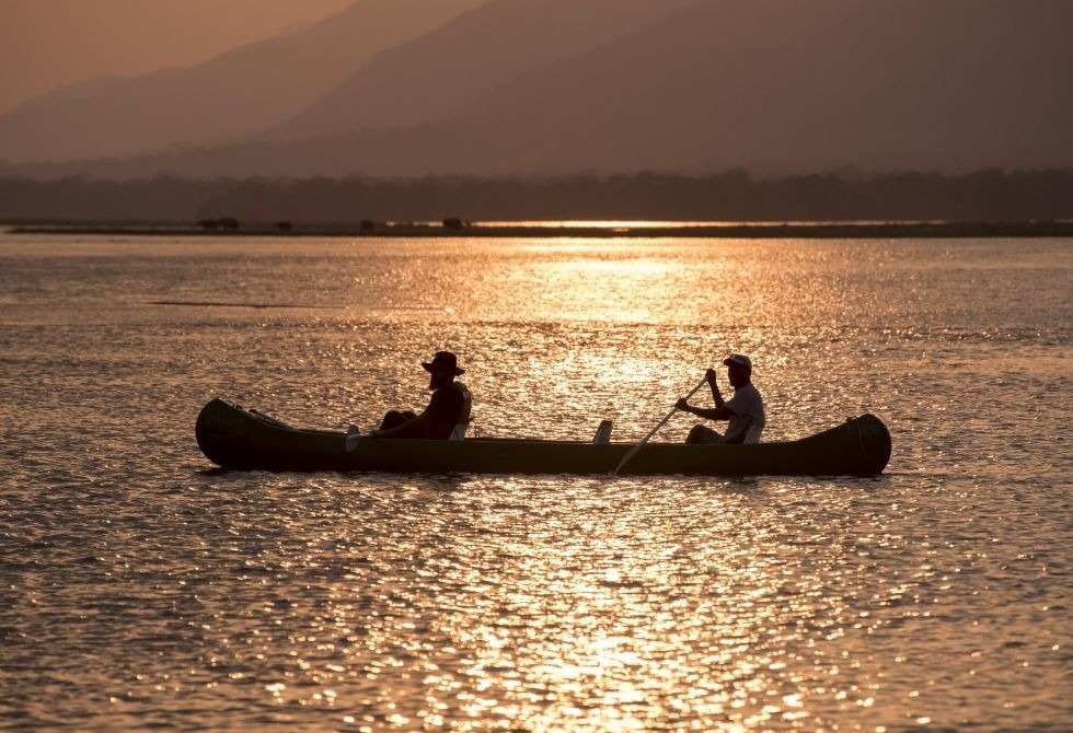 Where It All Began - Zimbabwe Canoeing Safari - Mana Pools Lodge Safari - Nyamatusi Camp - Two Men Canoeing on River