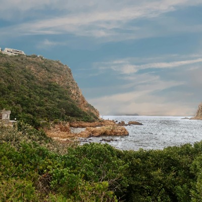 Where It All Began - Adventures - Wild Coast Hotel Hopper Thumbnail - Beautiful Coastal Mountain and Ocean