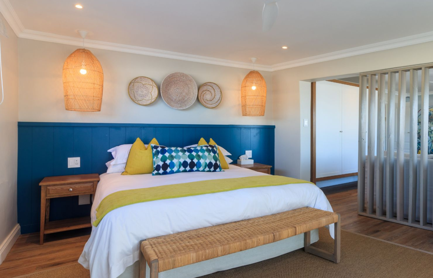S052 - IT2 - Bedroom Suite with Wooden Bench at Morgan Bay Hotel Where It All Began - Journeys - Wild Coast Hotel Hopper - Bedroom Suite with Wooden Bench at Morgan Bay Hotel