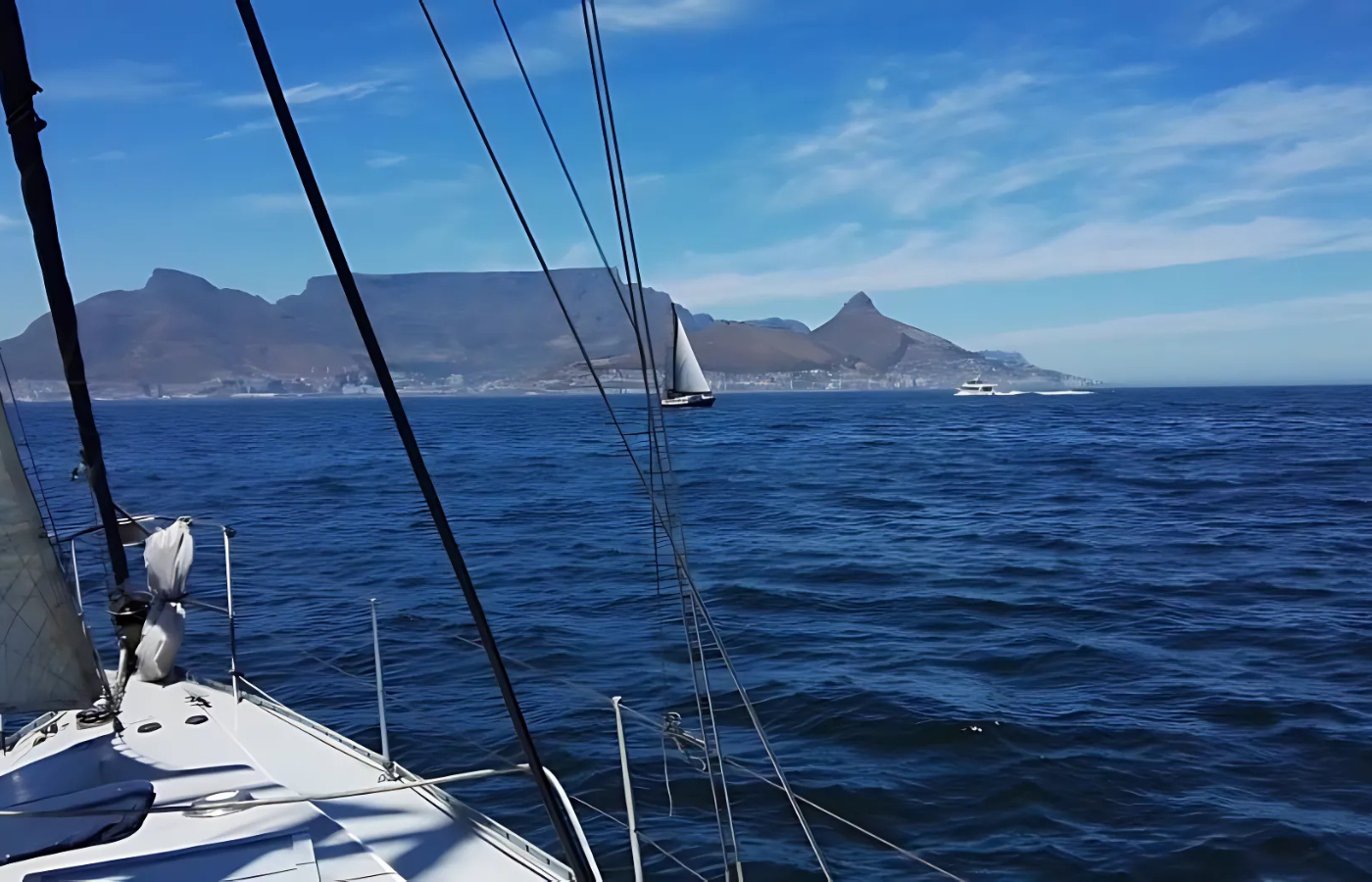 Where It All Began - Journeys - Yacht Sailing around the Cape Peninsula - Side View of Boat and Table Mountain Background