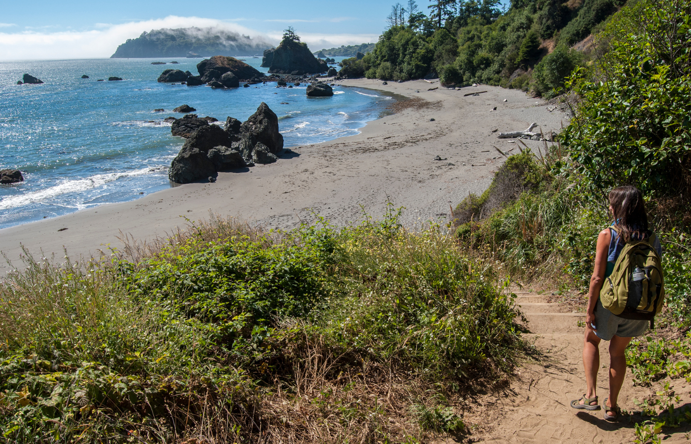 S052 - IT4 - Female Hiker on Beach Hike and Backpack Where It All Began - Journeys - Wild Coast Hotel Hopper - Female Hiker on Beach Hike and Backpack