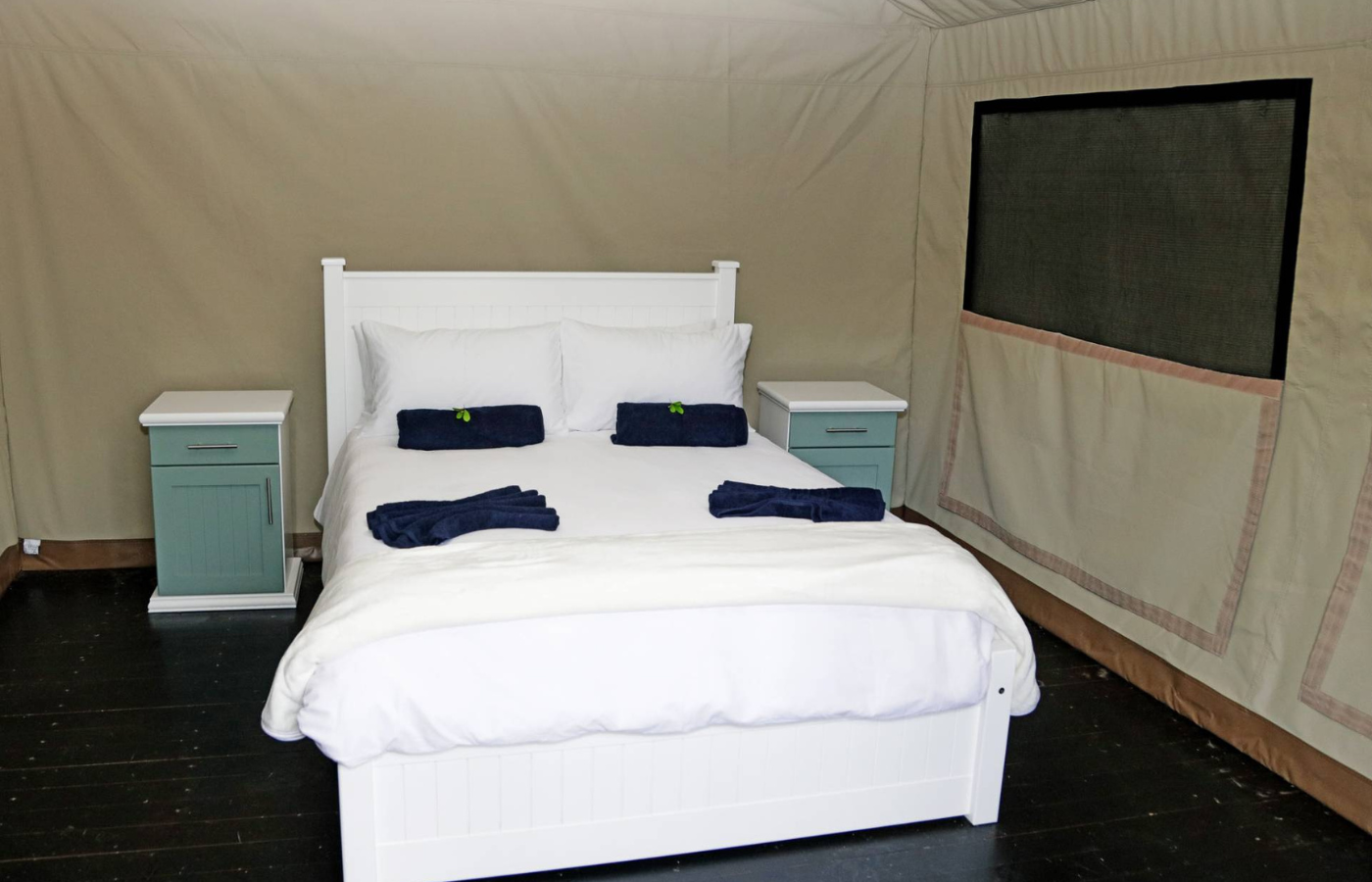 S050 - IT1 - Blue Themed Bedroom and Double Bed at Accommodation Where It All Began - Journeys - Tropical African Lake and Forrest Slackpacking Adventure - Blue Themed Bedroom and Double Bed at Accommodation