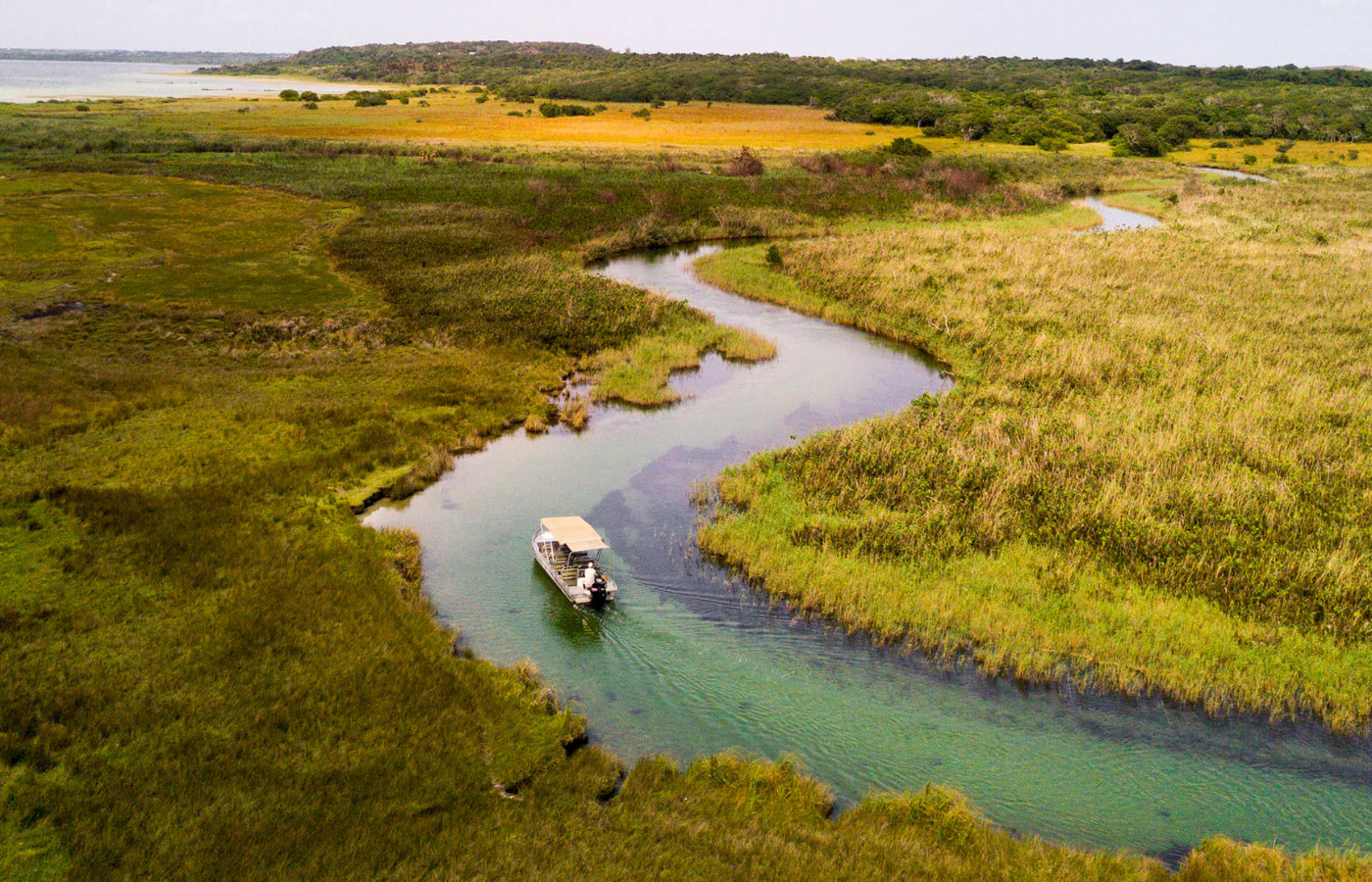 S050 - IT2 - Boat on Trip Through Wetlands and Lake Where It All Began - Journeys - Tropical African Lake and Forrest Slackpacking Adventure - Boat on Trip Through Wetlands and Lake