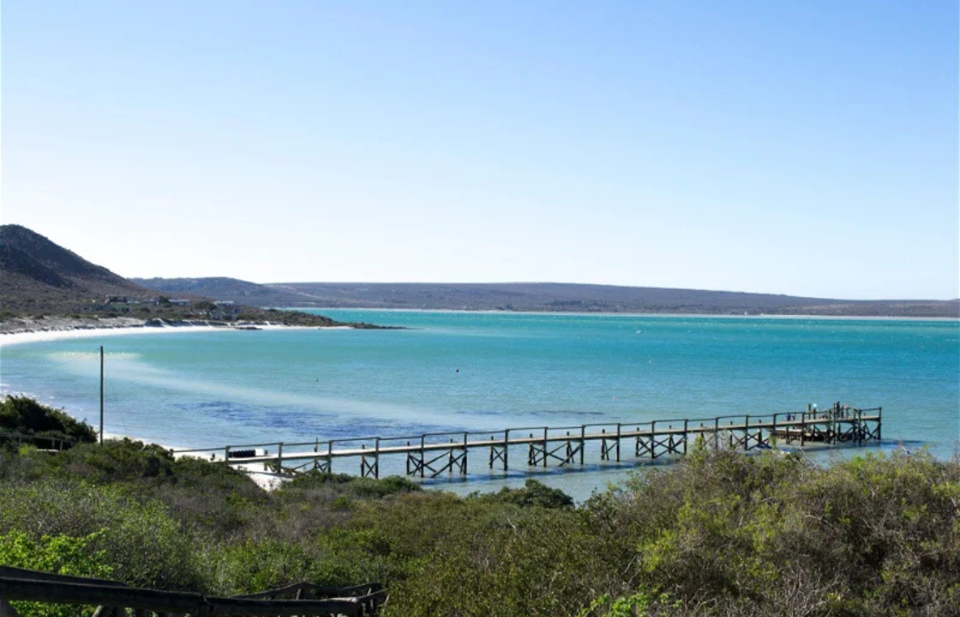 Where It All Began - Journeys - Kitesurfing & Houseboat Escape on the West Coast - Overhead Shot of Pier Leading into Beautiful Blue Waters