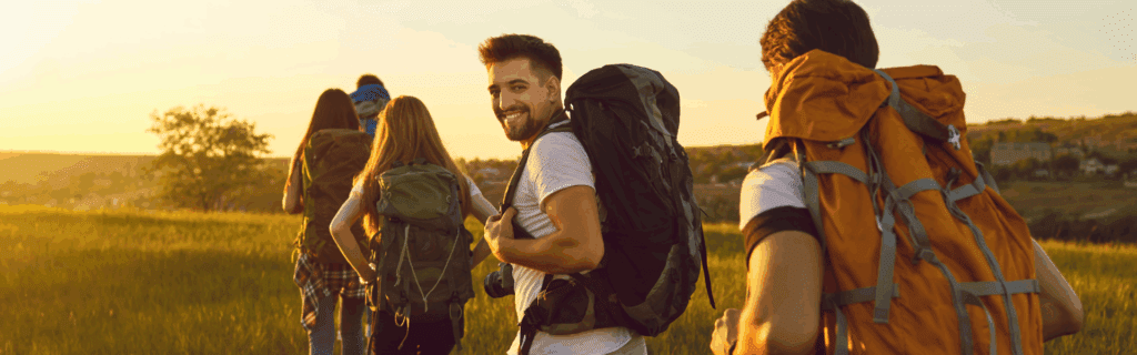 Where It All Began - Blog - Slackpacking - Tourists walking along path in grassy terrain